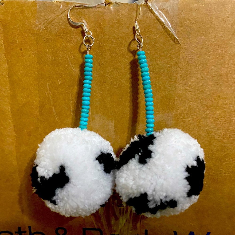 Medium sized Cow Print Pom Pom Earrings.